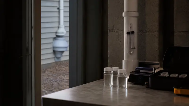 Well water sample vials on a counter